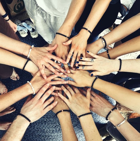 Align Yoga cohort hands together